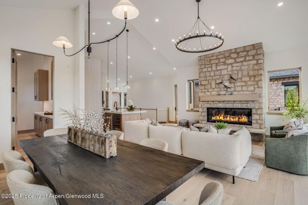 Dining room, Fireplace, Interior, Living room, Pendant Lights, Recessed Lighting, Stone Walls, Wood Texture Flooring