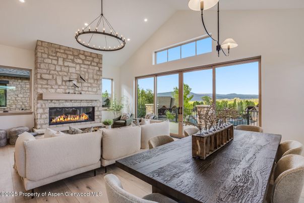 Dining room, Fireplace, Interior, Living room, Pendant Lights, Recessed Lighting, Wood Texture Flooring