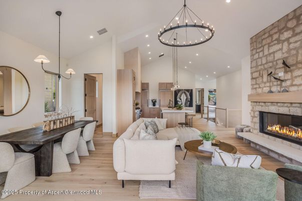 Dining room, Fireplace, Interior, Living room, Pendant Lights, Recessed Lighting, Stone Walls, Wood Texture Flooring