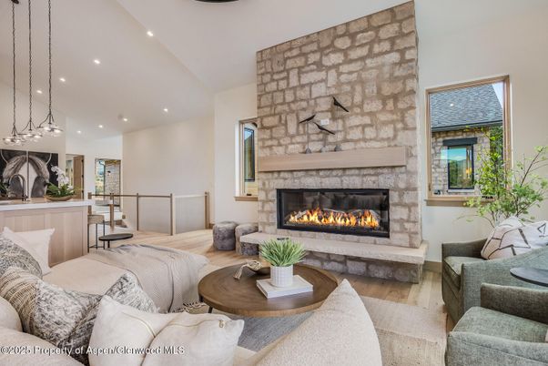 Fireplace, Interior, Living room, Pendant Lights, Recessed Lighting, Stone Walls, Wood Texture Flooring