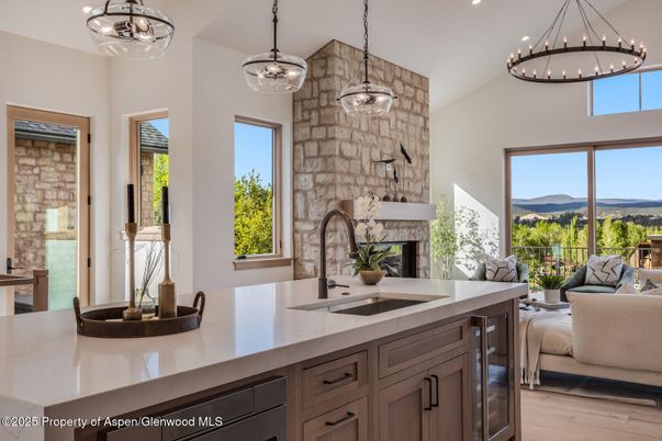 Fireplace, Interior, Kitchen, Living room, Pendant Lights, Recessed Lighting, Stone Walls, Wood Texture Flooring