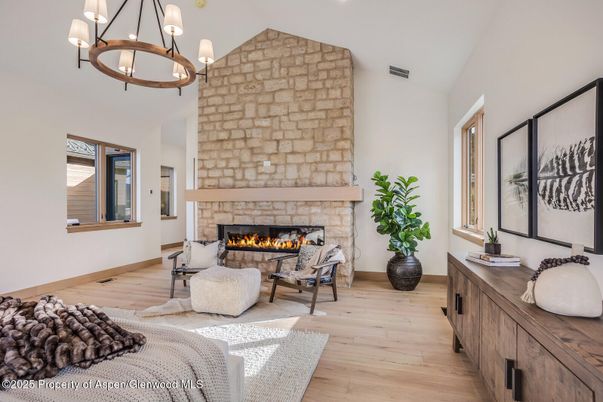 Fireplace, Interior, Living room, Pendant Lights, Recessed Lighting, Stone Walls, Wood Texture Flooring