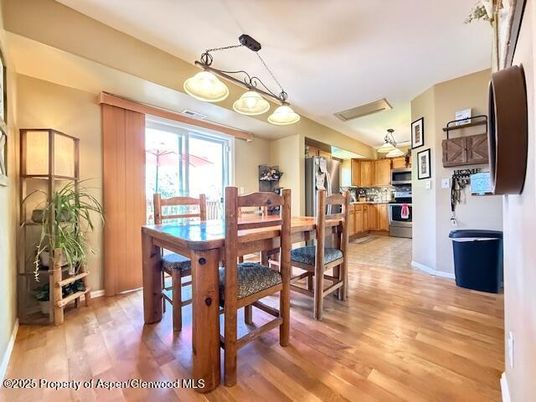 Dining room, Interior, Kitchen, Pendant Lights, Stainless Steel Appliances, Wood Texture Flooring