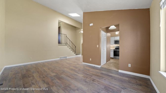 Empty room, Interior, Kitchen, Stainless Steel Appliances, Wood Texture Flooring