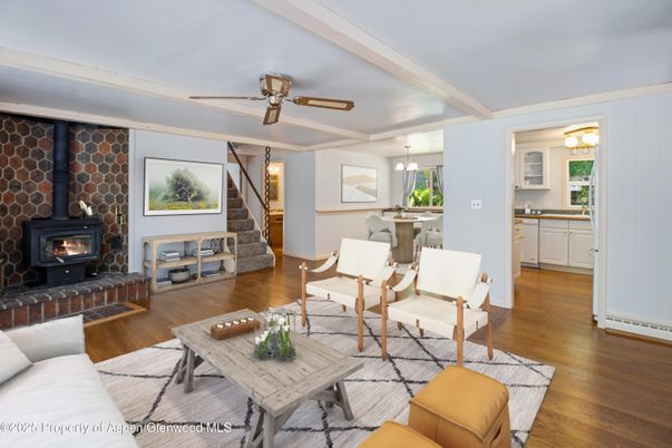 Dining room, Fireplace, Interior, Living room, Pendant Lights, Stone Walls, Wood Texture Flooring
