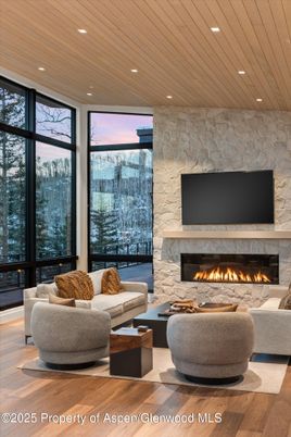 Fireplace, Interior, Living room, Recessed Lighting, Stone Walls, Wooden Ceilings, Wood Texture Flooring
