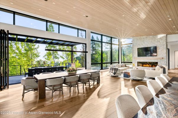 Dining room, Fireplace, Interior, Living room, Pendant Lights, Recessed Lighting, Stone Walls, Wooden Ceilings, Wood Texture Flooring