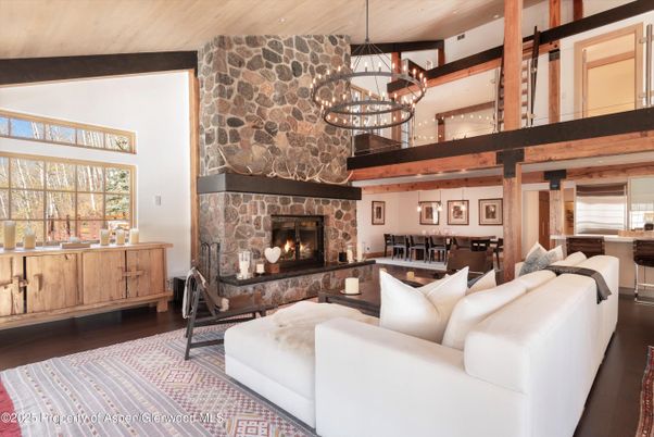 Chandelier, Dining room, Fireplace, Interior, Living room, Pendant Lights, Stone Walls, Wooden Beams, Wooden Ceilings, Wood Texture Flooring