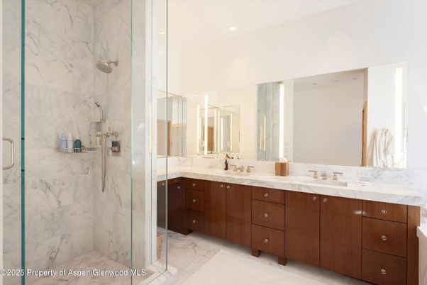 Bathroom, Dual Sink Vanities, Glass Shower, Interior, Marble, Marble Walls, Recessed Lighting
