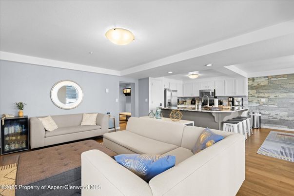 Interior, Kitchen, Living room, Recessed Lighting, Stainless Steel Appliances, Stone Walls, Wood Texture Flooring