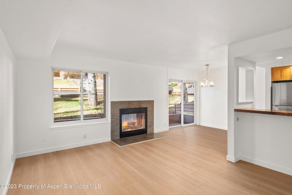 Empty room, Fireplace, Interior, Pendant Lights, Recessed Lighting, Wood Texture Flooring