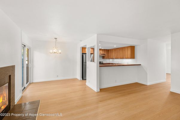 Chandelier, Fireplace, Interior, Kitchen, Pendant Lights, Recessed Lighting, Wood Texture Flooring