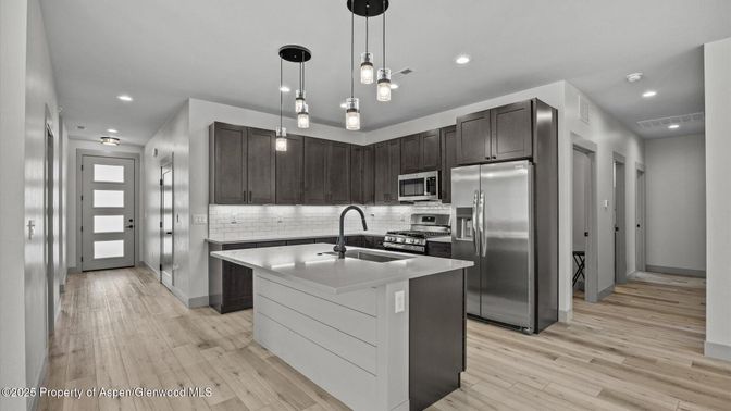 Interior, Kitchen, Pendant Lights, Recessed Lighting, Stainless Steel Appliances, Wood Texture Flooring