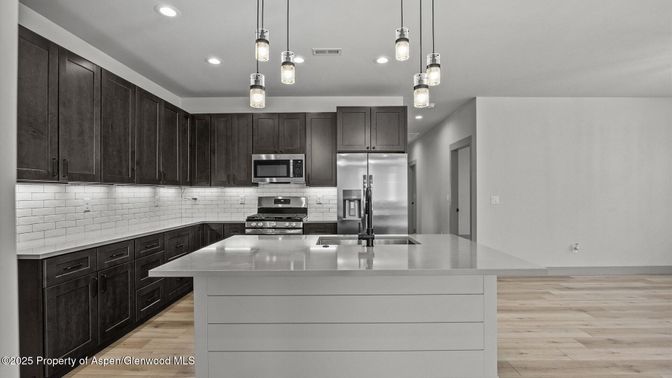 Interior, Kitchen, Pendant Lights, Recessed Lighting, Stainless Steel Appliances, Wood Texture Flooring