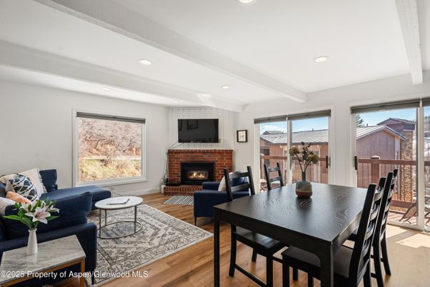 Dining room, Fireplace, Interior, Living room, Recessed Lighting, Wood Texture Flooring