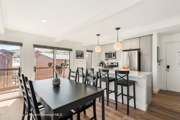Dining room, Interior, Kitchen, Pendant Lights, Recessed Lighting, Stainless Steel Appliances, Wood Texture Flooring