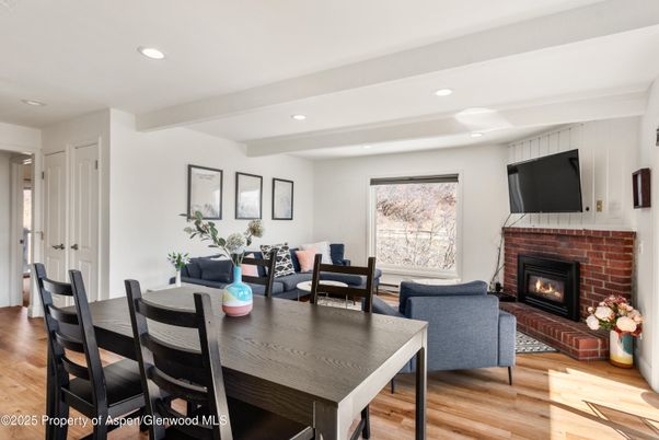 Dining room, Fireplace, Interior, Living room, Recessed Lighting, Wood Texture Flooring