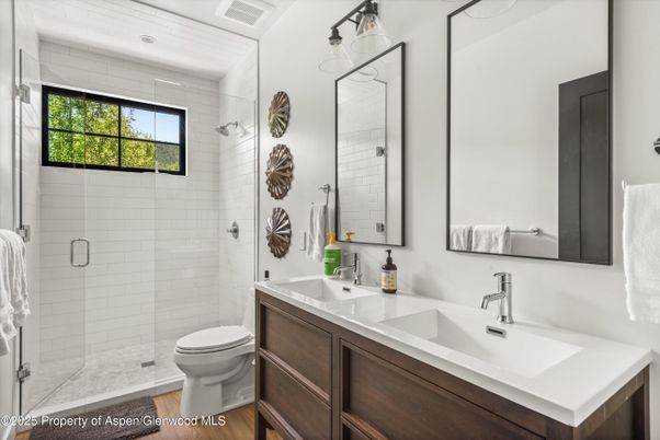 Bathroom, Dual Sink Vanities, Glass Shower, Interior, Wood Texture Flooring