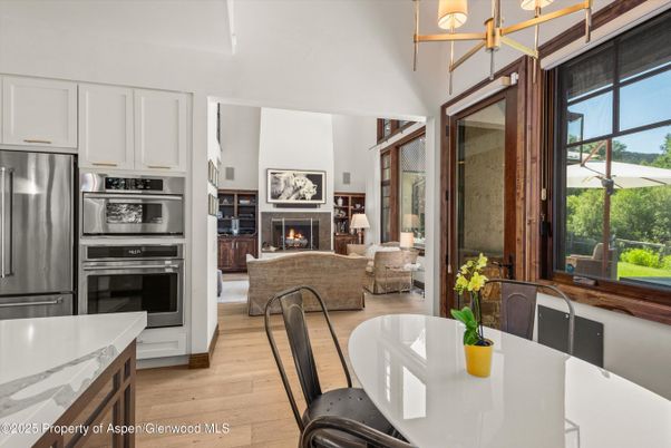 Dining room, Fireplace, Interior, Kitchen, Living room, Stainless Steel Appliances, Wood Texture Flooring