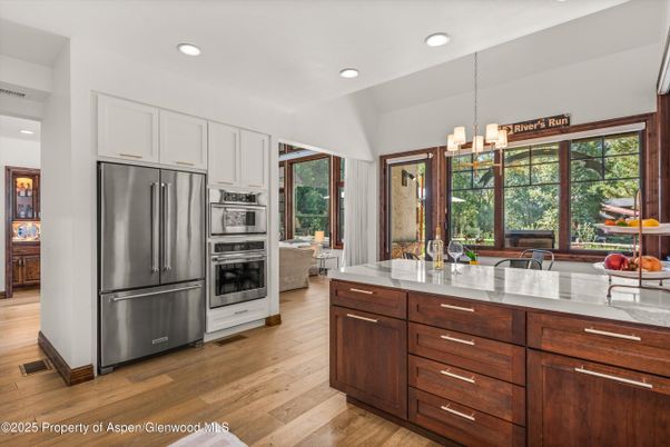 Chandelier, Interior, Kitchen, Pendant Lights, Recessed Lighting, Stainless Steel Appliances, Wood Texture Flooring