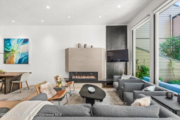 Dining room, Fireplace, Interior, Living room, Recessed Lighting, Wood Texture Flooring