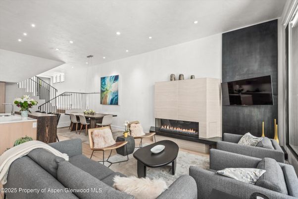 Dining room, Fireplace, Interior, Living room, Pendant Lights, Recessed Lighting, Wood Texture Flooring