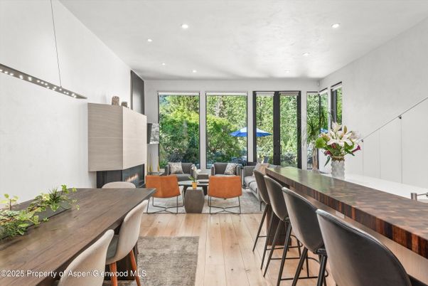 Dining room, Fireplace, Interior, Living room, Recessed Lighting, Wood Texture Flooring