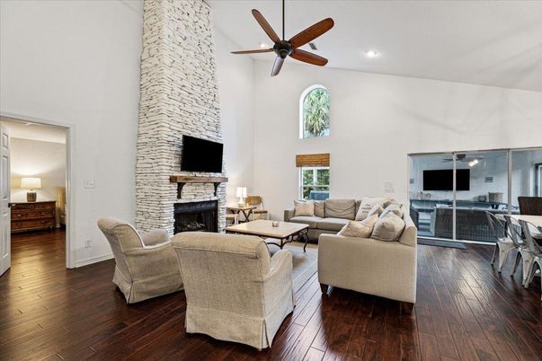 Fireplace, Interior, Living room, Recessed Lighting, Stone Walls, Wood Texture Flooring