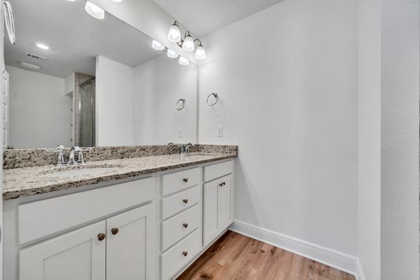 Bathroom, Dual Sink Vanities, Interior, Recessed Lighting, Wood Texture Flooring