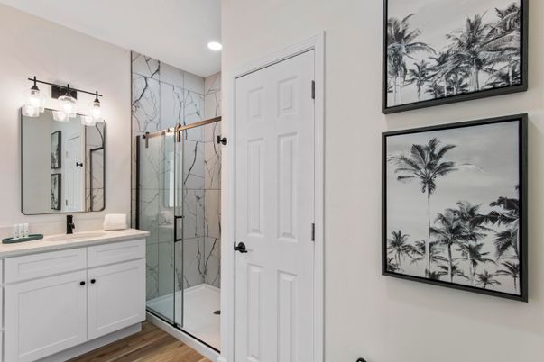Bathroom, Glass Shower, Interior, Marble Walls, Recessed Lighting, Wood Texture Flooring