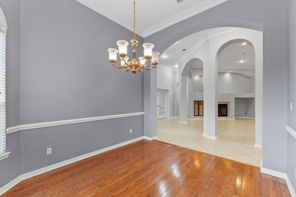 Chandelier, Empty room, Fireplace, Interior, Pendant Lights, Recessed Lighting, Wood Texture Flooring