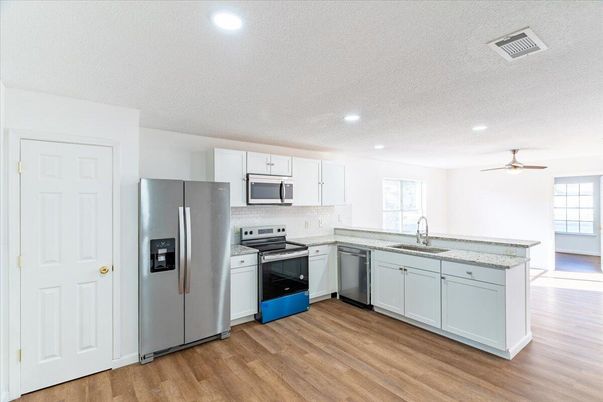 Interior, Kitchen, Recessed Lighting, Stainless Steel Appliances, Wood Texture Flooring