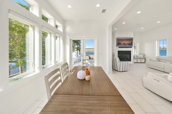 Dining room, Fireplace, Interior, Living room, Recessed Lighting, Water, Wood Texture Flooring