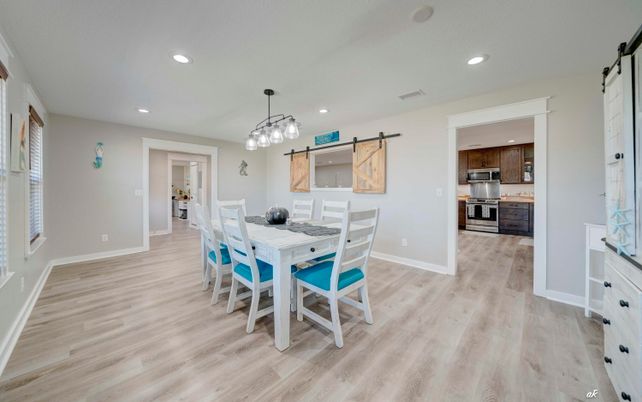 Dining room, Interior, Kitchen, Pendant Lights, Recessed Lighting, Stainless Steel Appliances, Wood Texture Flooring