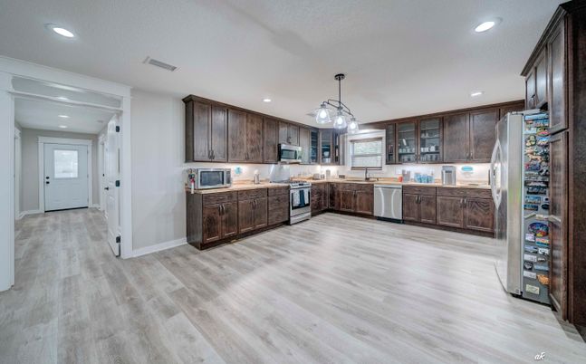 Interior, Kitchen, Pendant Lights, Recessed Lighting, Stainless Steel Appliances, Wood Texture Flooring