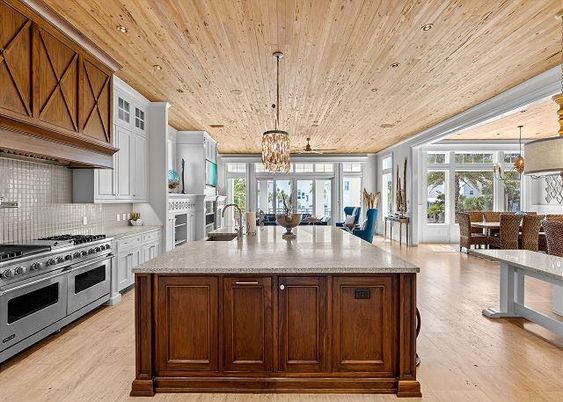 Chandelier, Dining room, Interior, Kitchen, Pendant Lights, Recessed Lighting, Stainless Steel Appliances, Wooden Ceilings, Wood Texture Flooring
