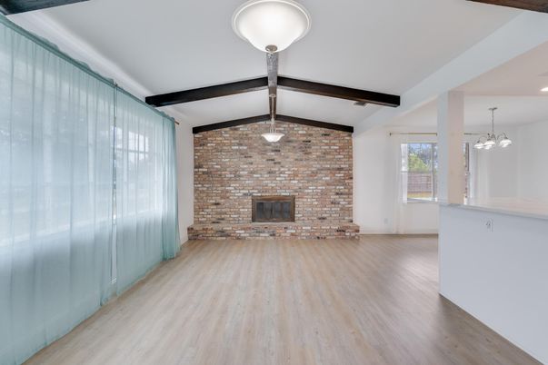 Empty room, Fireplace, Interior, Pendant Lights, Stone Walls, Wooden Beams, Wood Texture Flooring