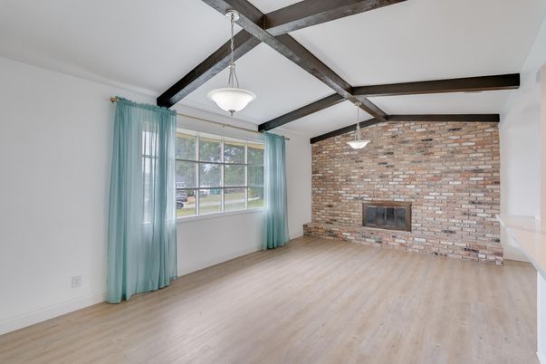 Empty room, Fireplace, Interior, Pendant Lights, Stone Walls, Wooden Beams, Wood Texture Flooring