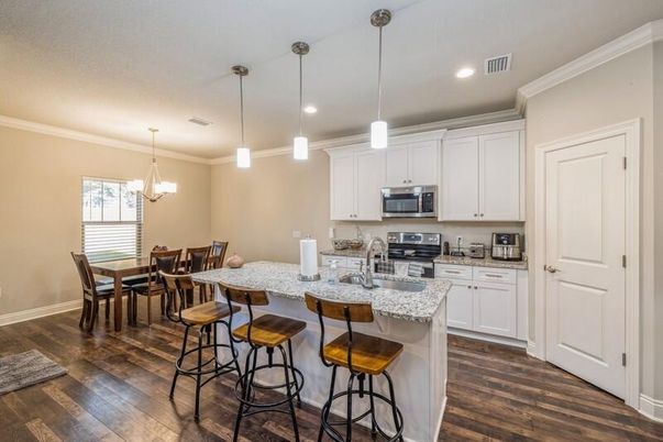 Dining room, Interior, Kitchen, Pendant Lights, Recessed Lighting, Stainless Steel Appliances, Wood Texture Flooring