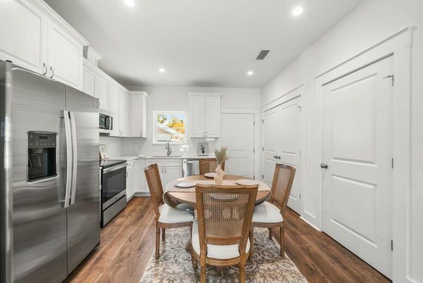 Dining room, Interior, Kitchen, Recessed Lighting, Stainless Steel Appliances, Wood Texture Flooring