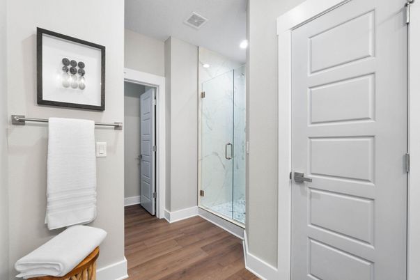 Bathroom, Glass Shower, Interior, Marble Walls, Recessed Lighting, Wood Texture Flooring