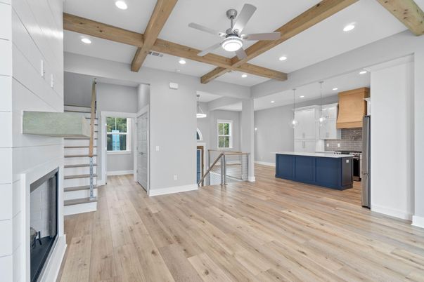 Fireplace, Interior, Kitchen, Pendant Lights, Recessed Lighting, Stainless Steel Appliances, Wooden Beams, Wood Texture Flooring