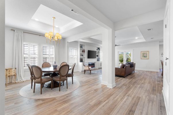 Chandelier, Dining room, Fireplace, Interior, Living room, Recessed Lighting, Wood Texture Flooring