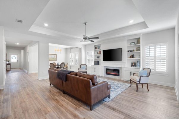 Chandelier, Dining room, Fireplace, Interior, Living room, Pendant Lights, Recessed Lighting, Wood Texture Flooring