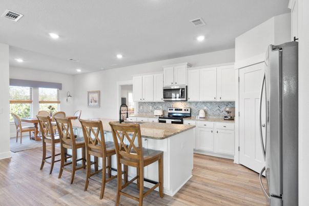 Dining room, Interior, Kitchen, Recessed Lighting, Stainless Steel Appliances, Wood Texture Flooring