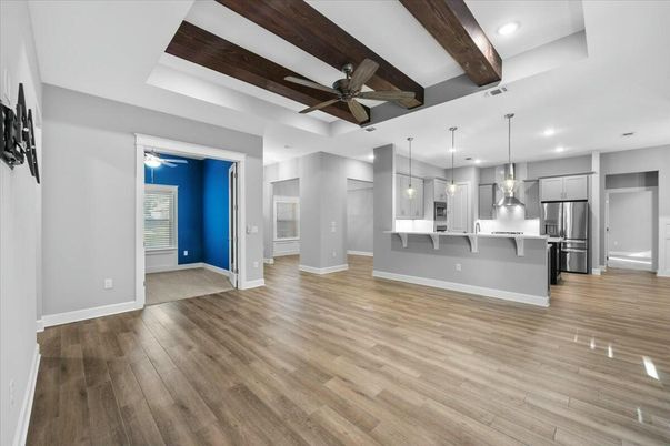 Empty room, Interior, Kitchen, Pendant Lights, Recessed Lighting, Stainless Steel Appliances, Wooden Beams, Wood Texture Flooring