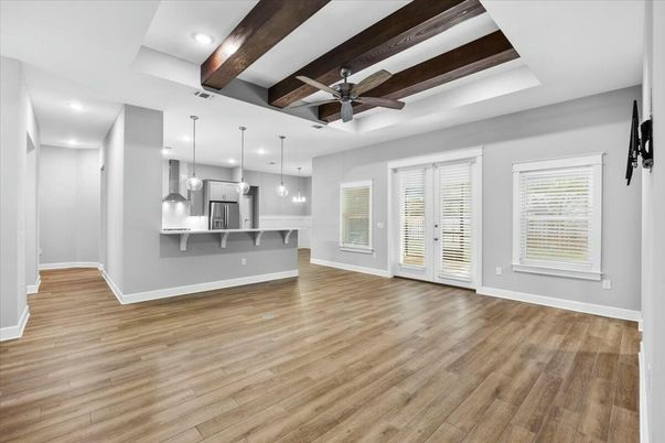 Empty room, Interior, Kitchen, Pendant Lights, Recessed Lighting, Stainless Steel Appliances, Wooden Beams, Wood Texture Flooring