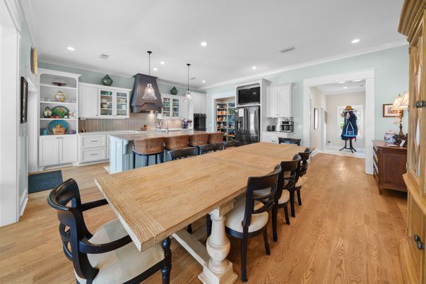 Dining room, Interior, Kitchen, Pendant Lights, Recessed Lighting, Stainless Steel Appliances, Wood Texture Flooring
