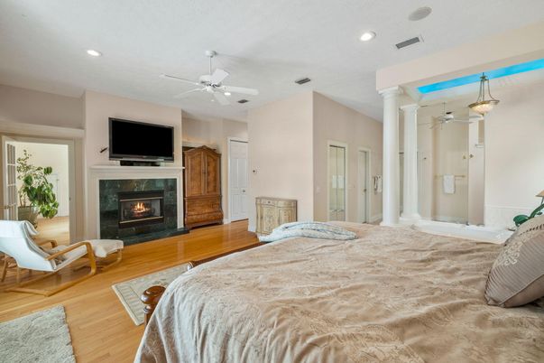 Bedroom, Fireplace, Interior, Pendant Lights, Recessed Lighting, Wood Texture Flooring