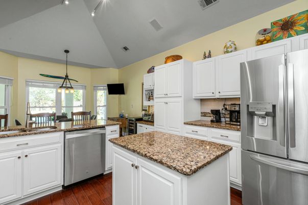 Dining room, Interior, Kitchen, Pendant Lights, Recessed Lighting, Stainless Steel Appliances, Wood Texture Flooring